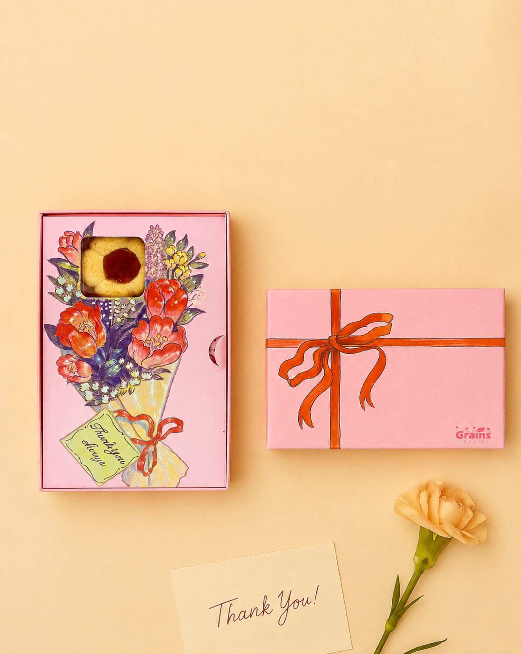 Grains Cookie floral gift box showing a cookie through the front window.